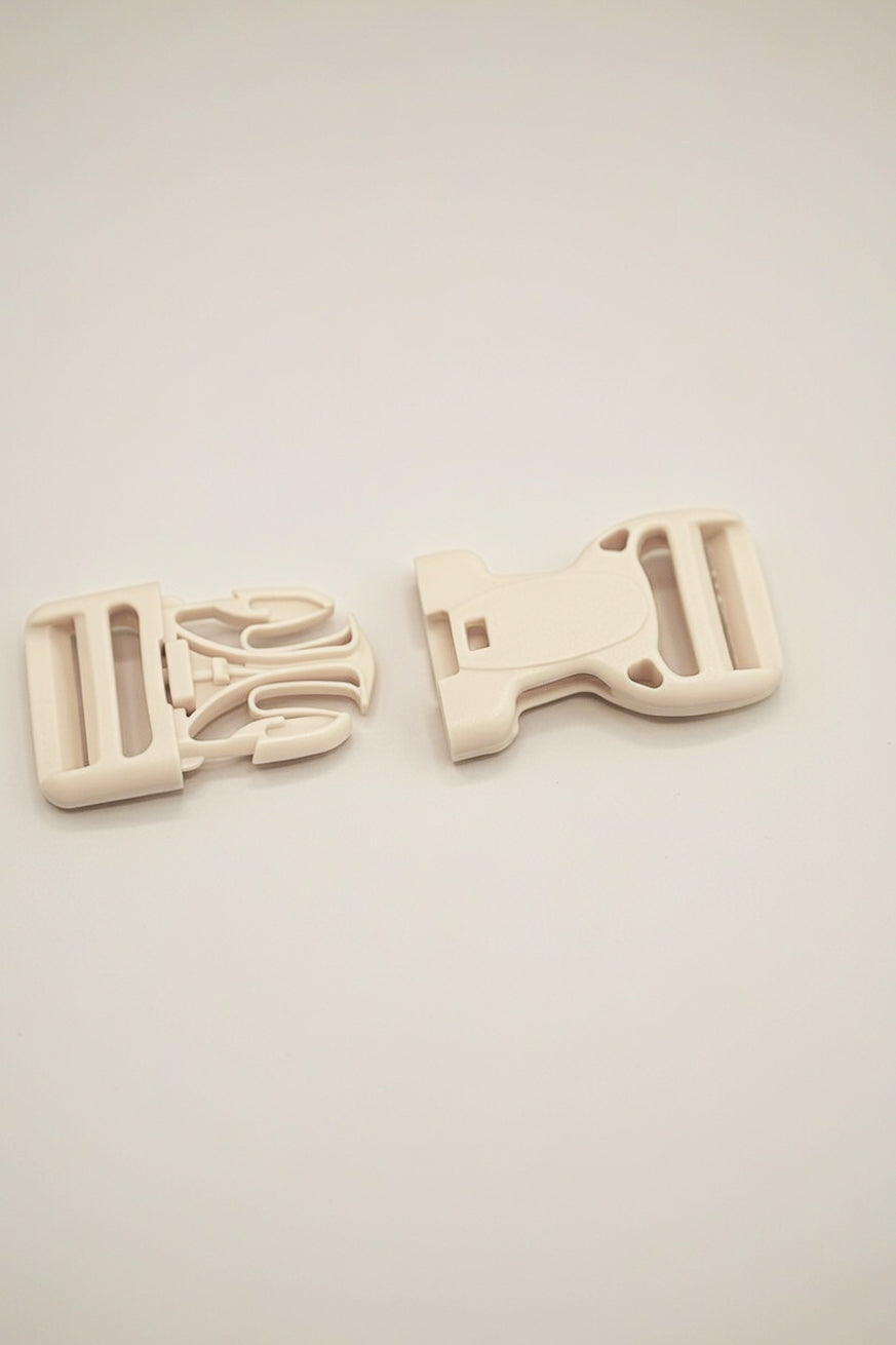 Schnalle mit Sicherheitsknopf 25mm beige